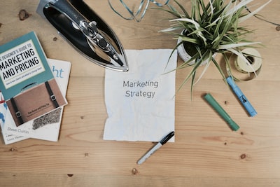 A note with the words marketing strategy on it as a reminder that AI driven SEO tools require strategy.
