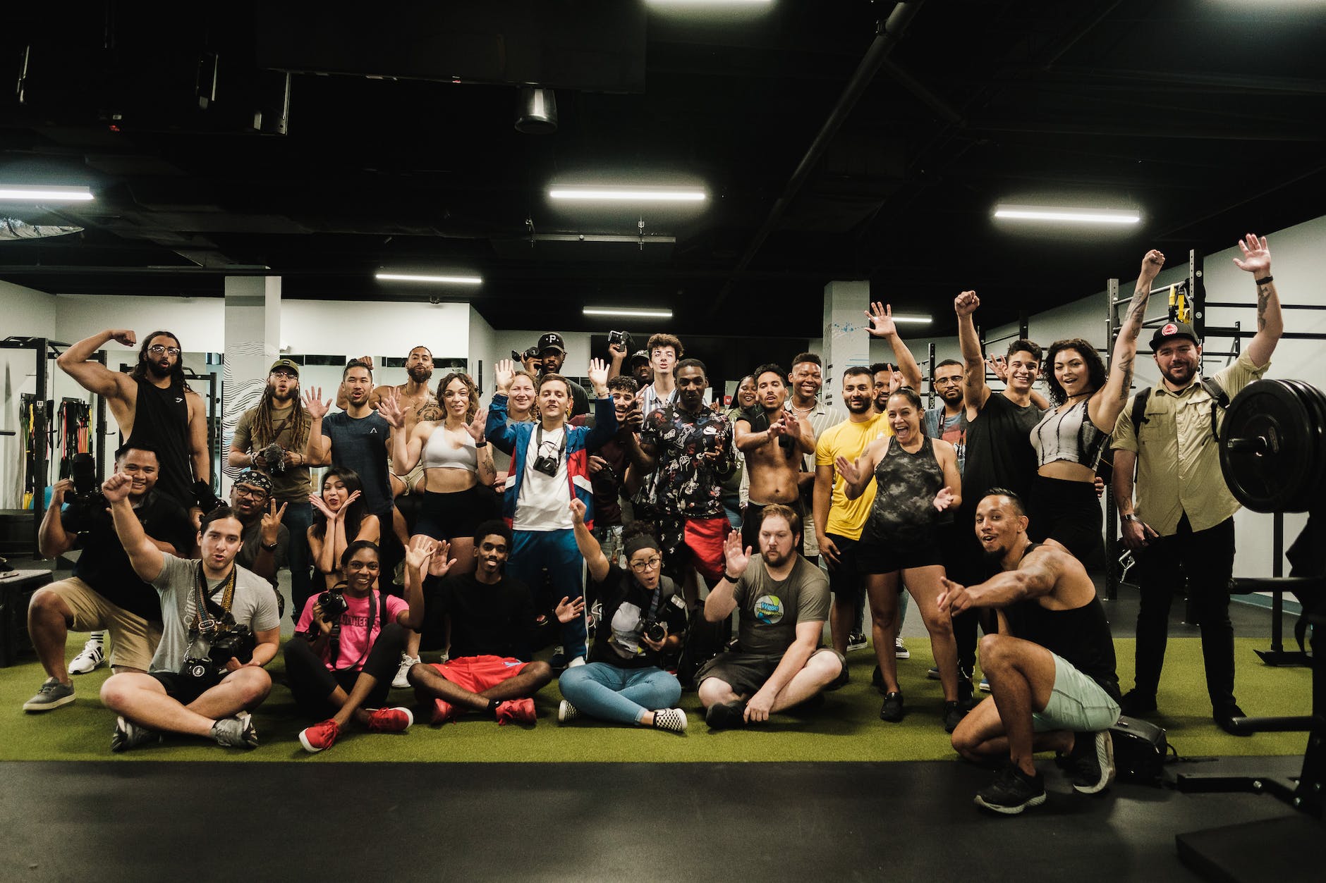 Gym members building local SEO authority for gyms in group photo.